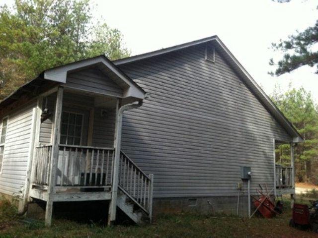 161 Old Word Road Bowdon, GA 30108 - Photo 1 of 1 a view of wooden house with a small yard