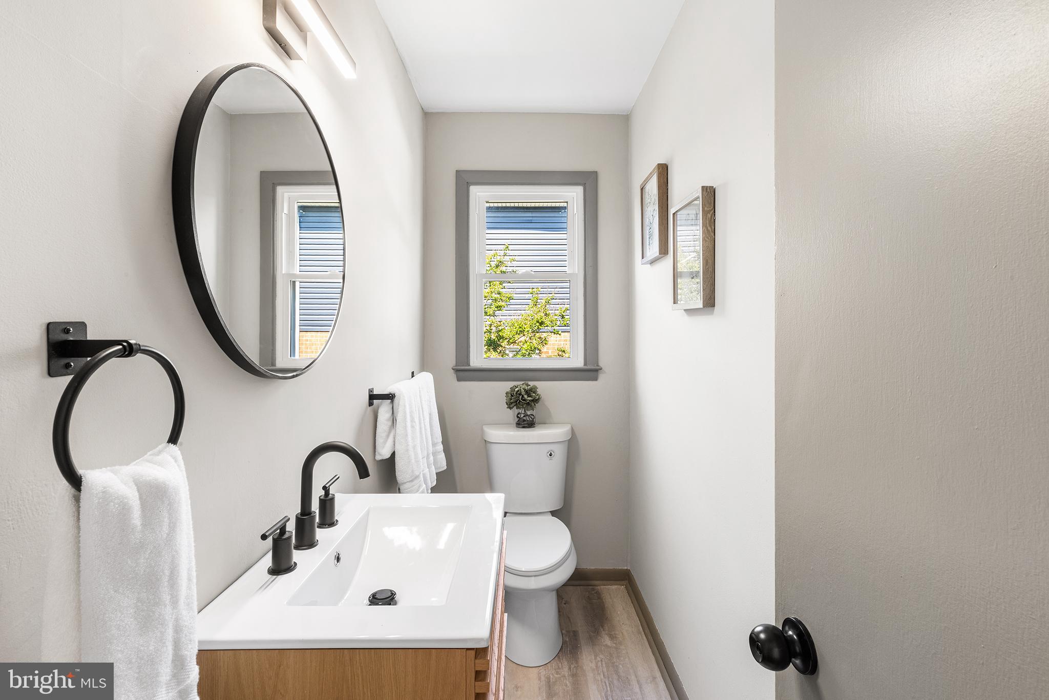 26 Virginia Circle Ridley Park, PA 19078 - Photo 9 of 49 a bathroom with a toilet sink and mirror