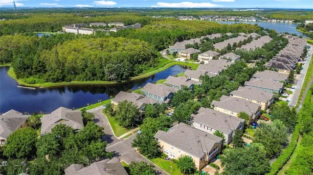 an aerial view of a house with a lake view