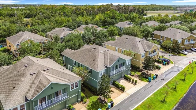 an aerial view of a house with a garden and swimming pool