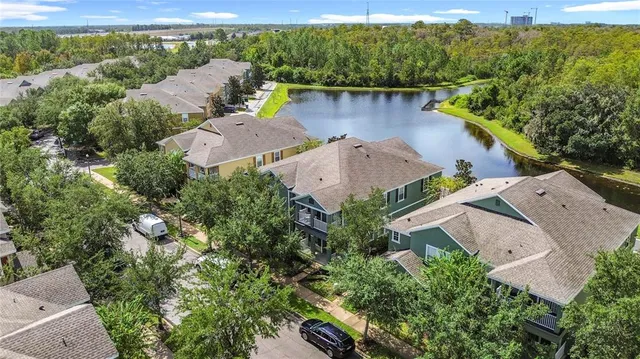an aerial view of house with yard swimming pool and outdoor seating