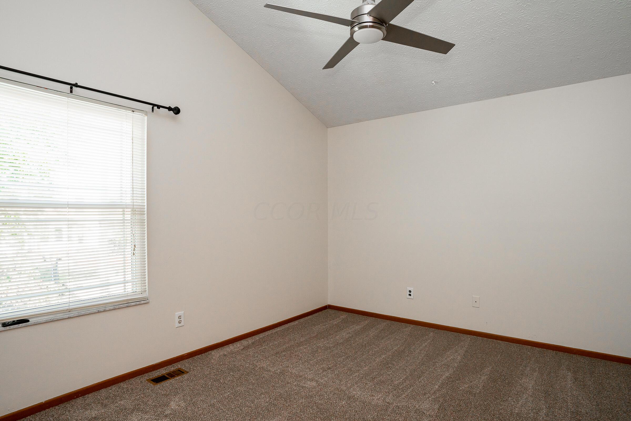 2135 Tonda Lane Grove City, OH 43123 - Photo 17 of 37 Primary bedroom features vaulted ceiling, freshly painted interior and 2 large closets