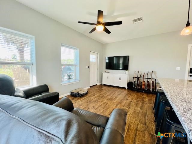 2824 Harrison Avenue Port O'Connor, TX 77982 - Photo 14 of 48 a living room with furniture and a flat screen tv
