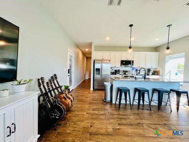 2824 Harrison Avenue Port O'Connor, TX 77982 - Photo 16 of 48 a large kitchen with lots of counter space and stainless steel appliances