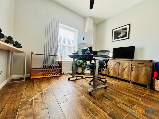 2824 Harrison Avenue Port O'Connor, TX 77982 - Photo 18 of 48 a view of a workspace with wooden floor