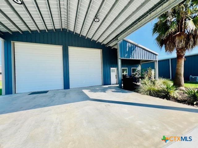 2824 Harrison Avenue Port O'Connor, TX 77982 - Photo 2 of 48 a house with palm tree in front of it