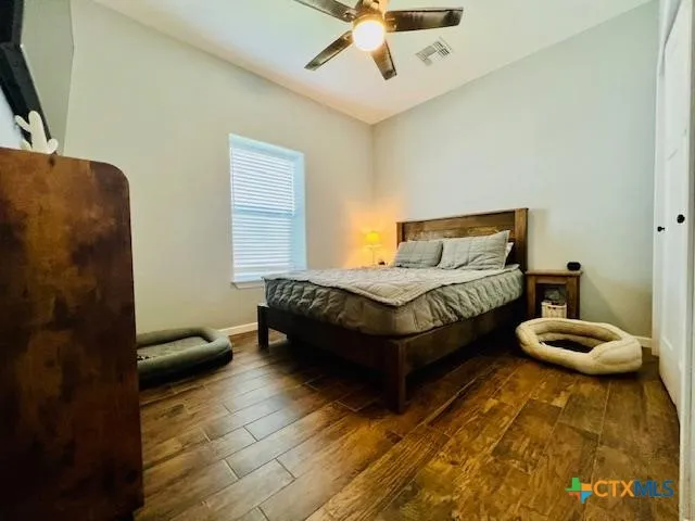 a bedroom with bed and window