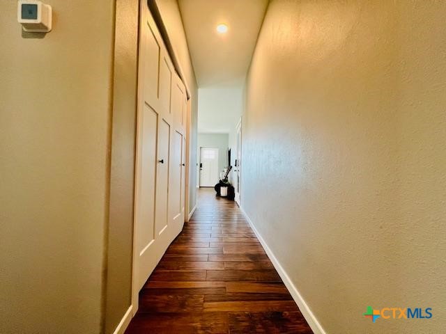 2824 Harrison Avenue Port O'Connor, TX 77982 - Photo 30 of 48 a view of a hallway with wooden floor and staircase