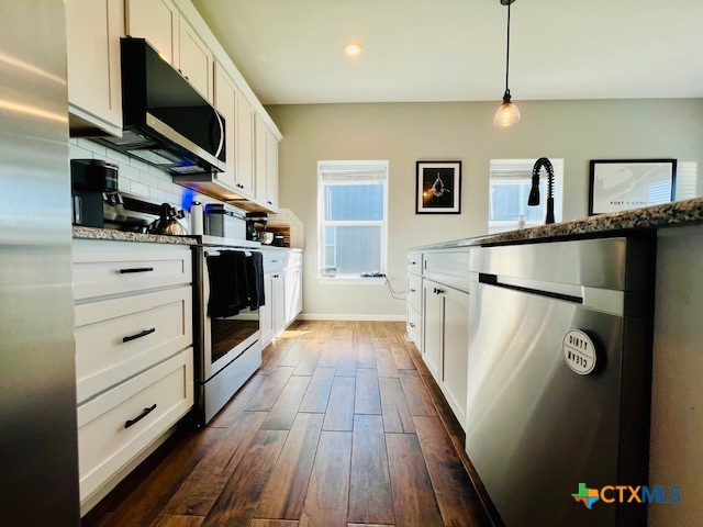 2824 Harrison Avenue Port O'Connor, TX 77982 - Photo 10 of 48 a view of walk in closet with clothes and shoes