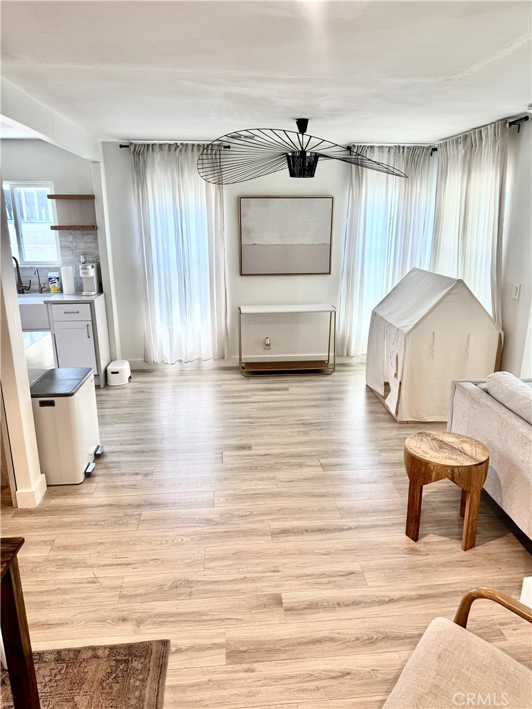 18913 Haas Avenue Torrance, CA 90504 - Photo 12 of 20 a living room with furniture and a wooden floor