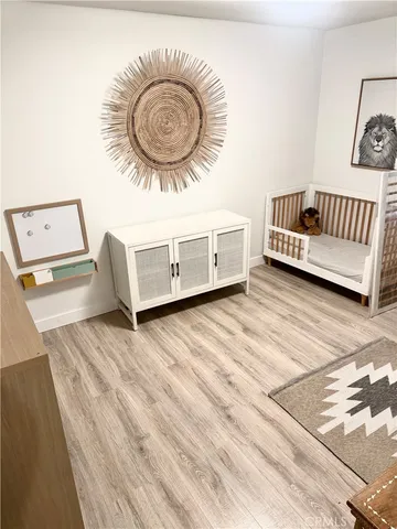 a view of a livingroom with furniture and a wooden floor
