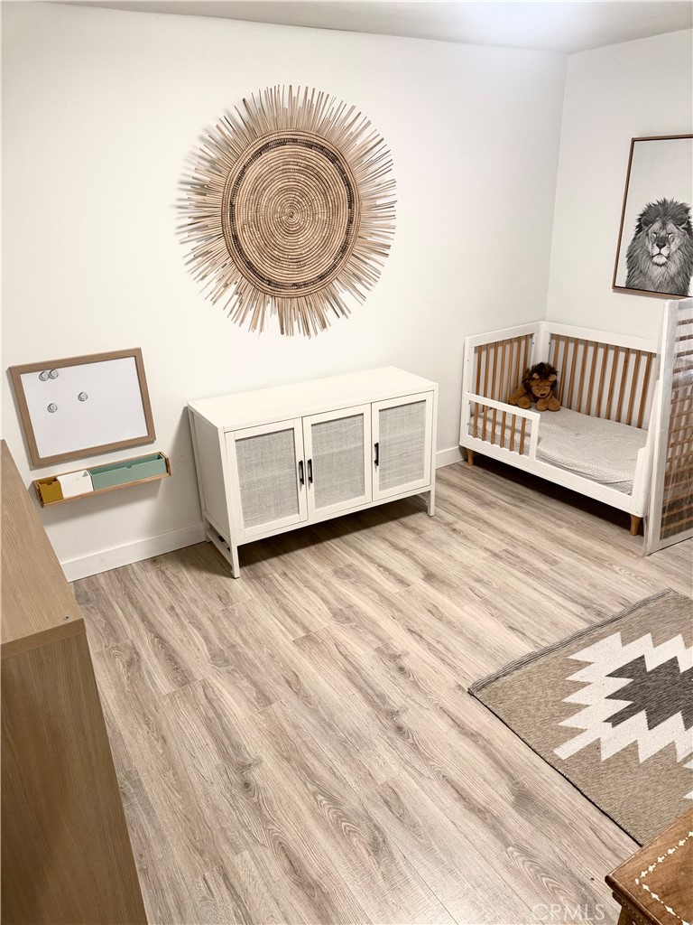 18913 Haas Avenue Torrance, CA 90504 - Photo 13 of 20 a view of a livingroom with furniture and a wooden floor