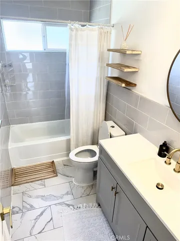 a bathroom with a sink a toilet and a bathtub