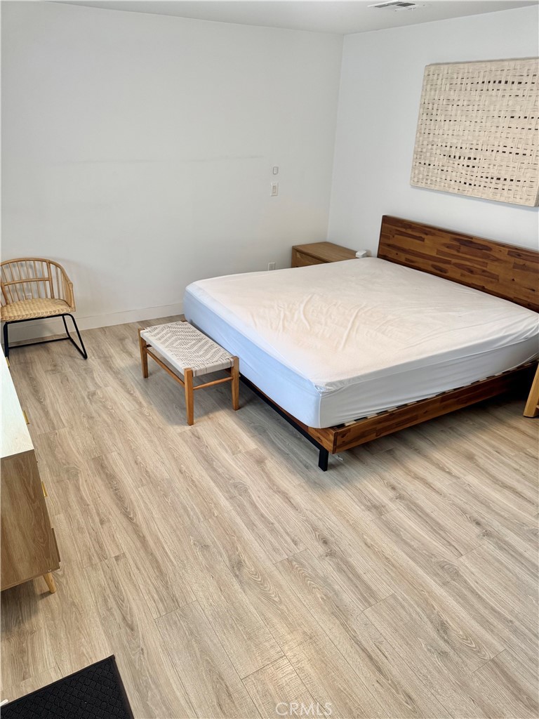 18913 Haas Avenue Torrance, CA 90504 - Photo 16 of 20 a bedroom with a bed and a table