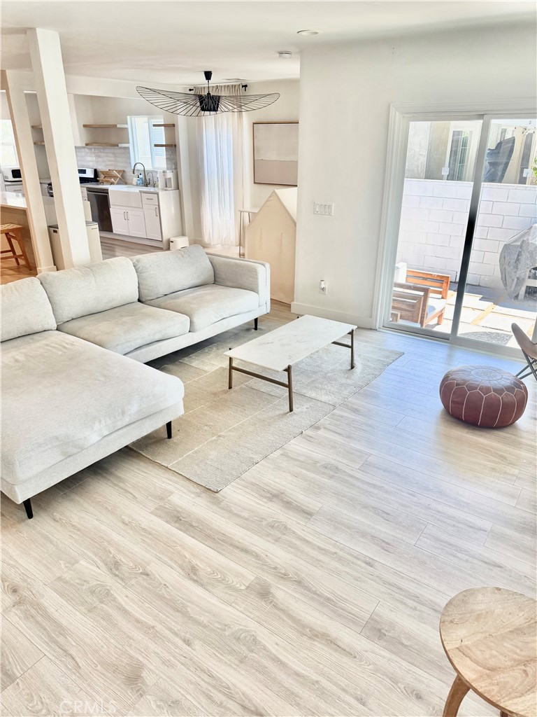 18913 Haas Avenue Torrance, CA 90504 - Photo 6 of 20 a living room with furniture and a wooden floor