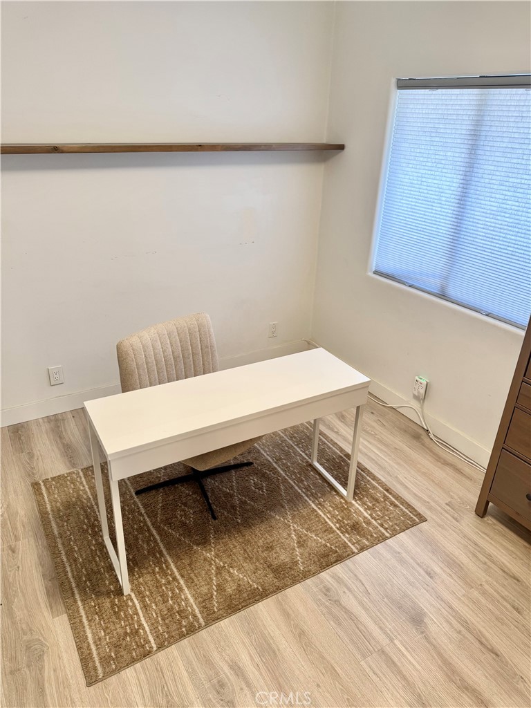 18913 Haas Avenue Torrance, CA 90504 - Photo 8 of 20 a view of a room with wooden floor and chair