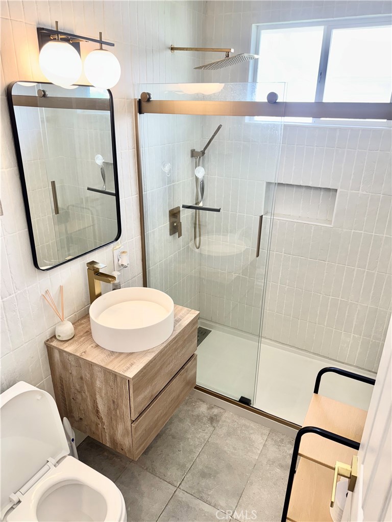 18913 Haas Avenue Torrance, CA 90504 - Photo 10 of 20 a bathroom with a sink toilet and shower