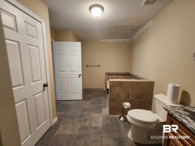 32749 Antietam Road Lillian, AL 36549 - Photo 10 of 47 Bathroom featuring vanity and toilet