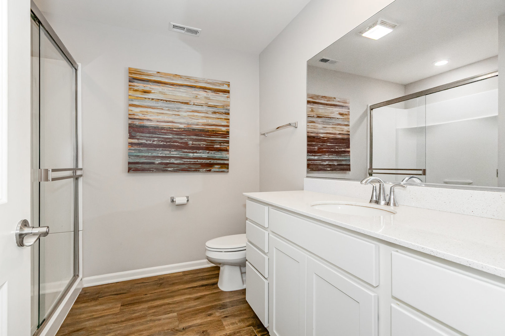 24724 McCormick Way Manhattan, IL 60442 - Photo 17 of 24 a bathroom with a granite countertop sink toilet and mirror