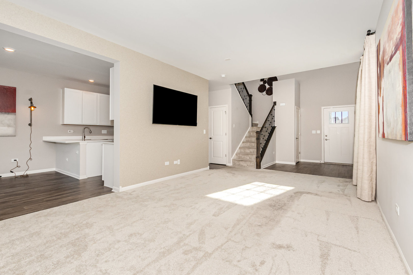 24724 McCormick Way Manhattan, IL 60442 - Photo 4 of 24 a view of a livingroom with a kitchen and a sink