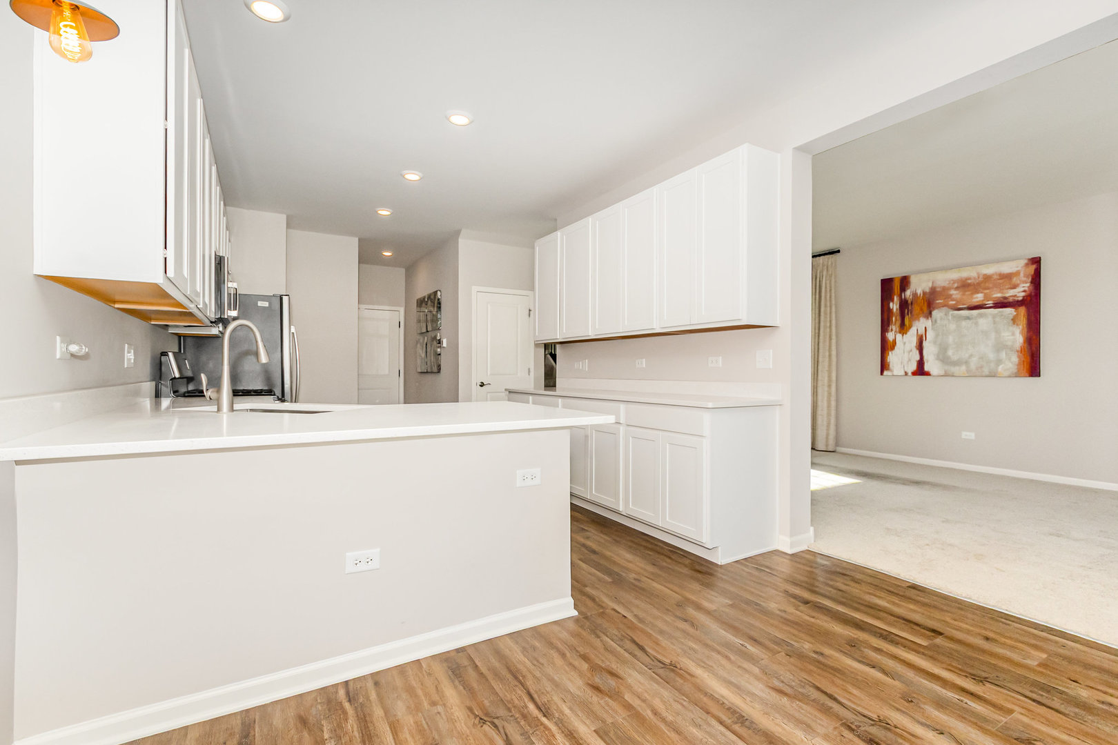 24724 McCormick Way Manhattan, IL 60442 - Photo 8 of 24 a kitchen with stainless steel appliances granite countertop a refrigerator a sink and white cabinets