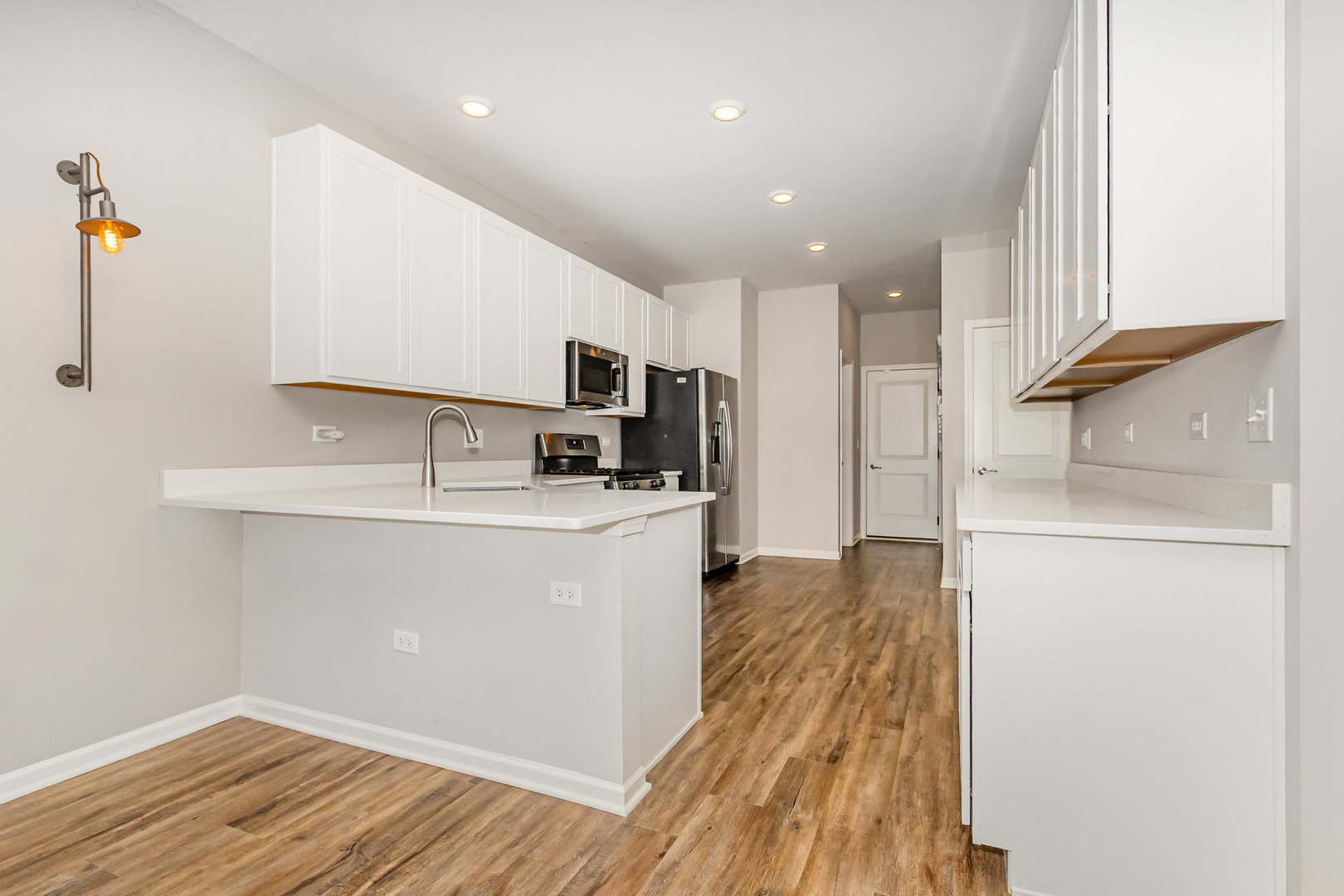 24724 McCormick Way Manhattan, IL 60442 - Photo 9 of 24 a kitchen with a refrigerator and a stove top oven
