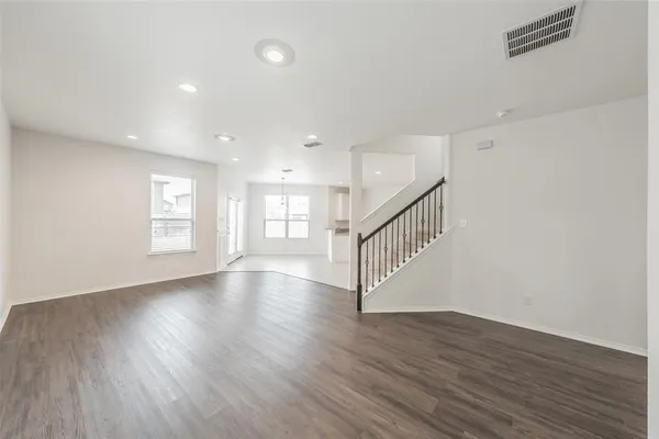 a view of kitchen with wooden floor and window
