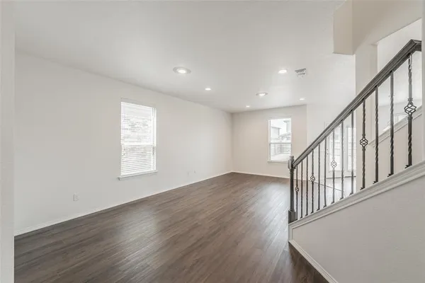 a view of an entryway with wooden floor