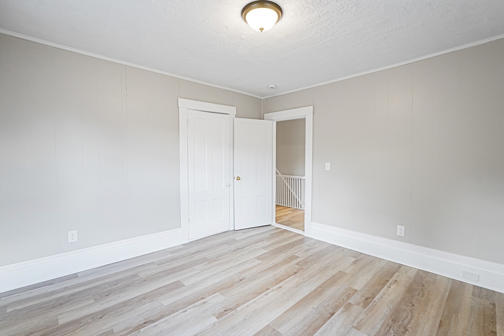 72 Main Street Pepperell, MA 01463 - Photo 11 of 26 a view of empty room with wooden floor