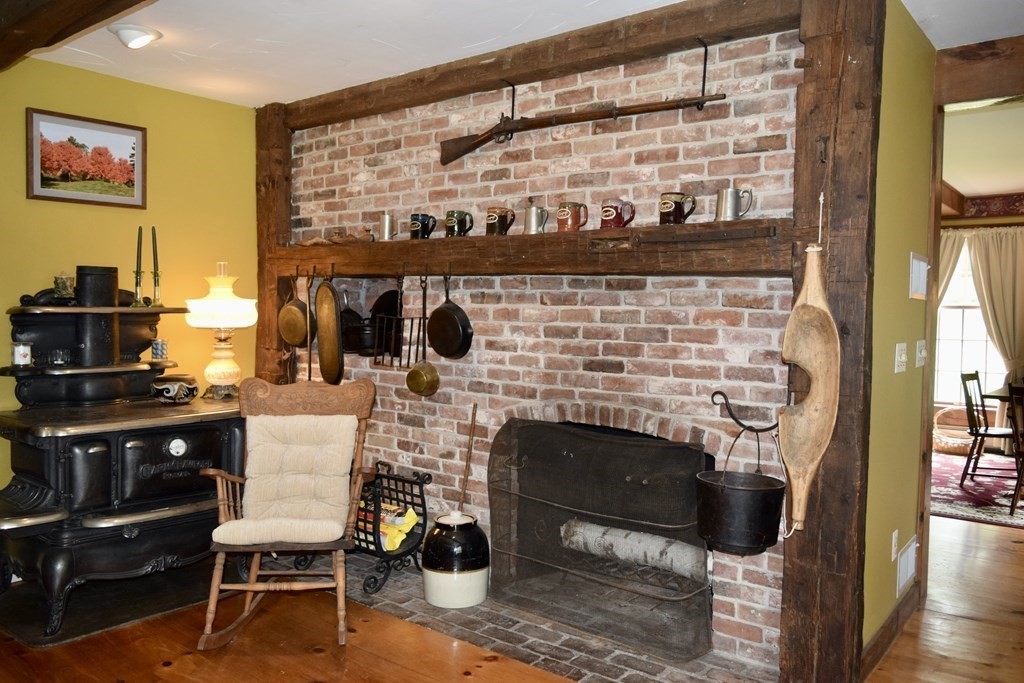 62 West Branch Road Ashfield, MA 01330 - Photo 15 of 42 a living room with furniture a flat screen tv and a fireplace