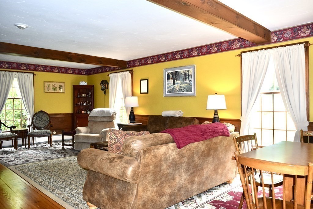 62 West Branch Road Ashfield, MA 01330 - Photo 18 of 42 a living room with furniture and a large window