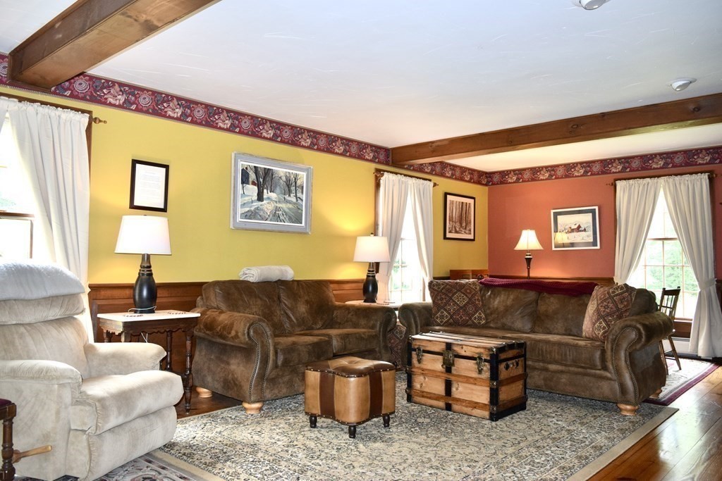 62 West Branch Road Ashfield, MA 01330 - Photo 19 of 42 a living room with furniture and a large window