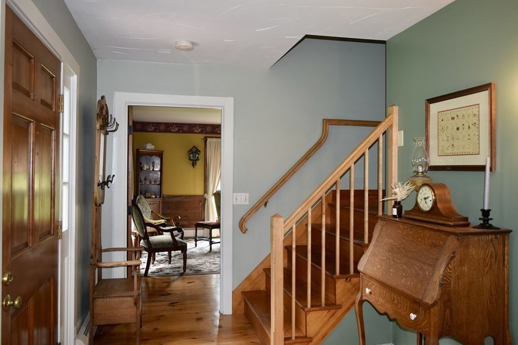 62 West Branch Road Ashfield, MA 01330 - Photo 22 of 42 a view of an entryway with wooden floor and stairs