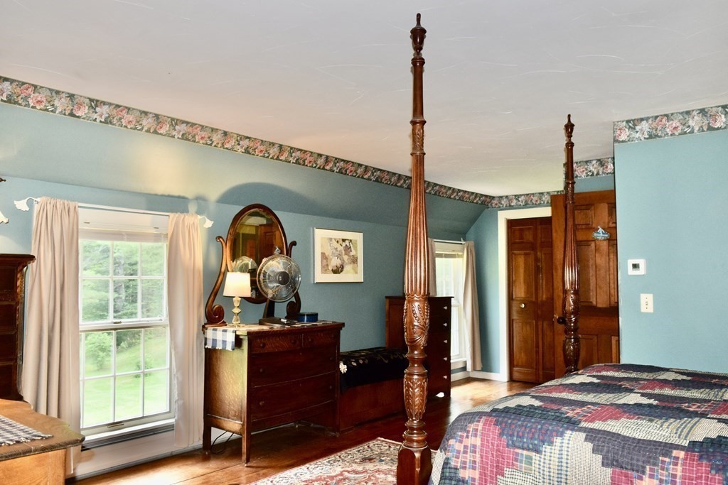 62 West Branch Road Ashfield, MA 01330 - Photo 28 of 42 a bedroom with a bed dresser and a window