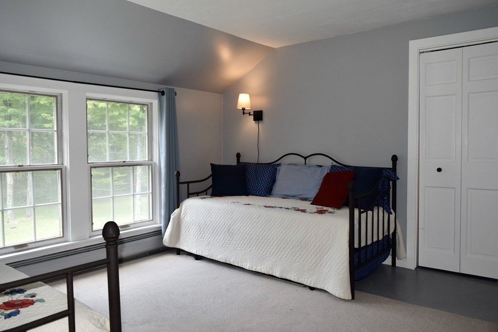 62 West Branch Road Ashfield, MA 01330 - Photo 33 of 42 a bedroom with a bed and window
