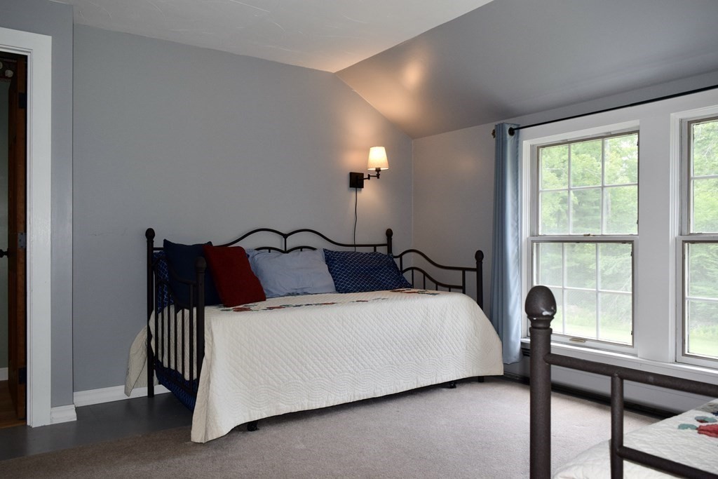 62 West Branch Road Ashfield, MA 01330 - Photo 34 of 42 a large bedroom with a bed and large window