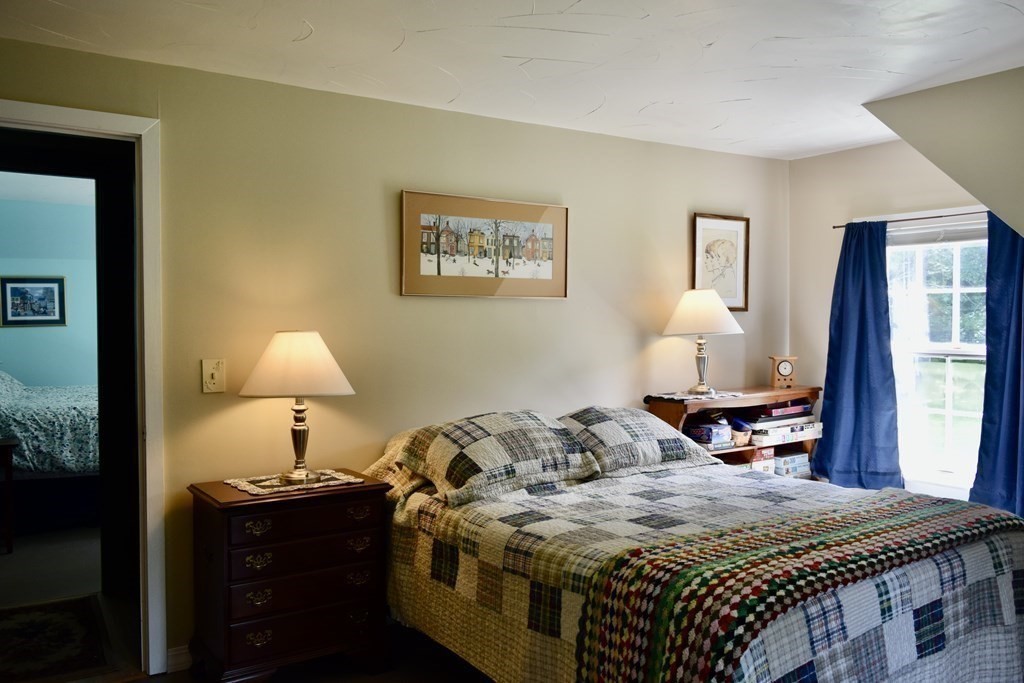 62 West Branch Road Ashfield, MA 01330 - Photo 35 of 42 a bedroom with a bed and a dresser