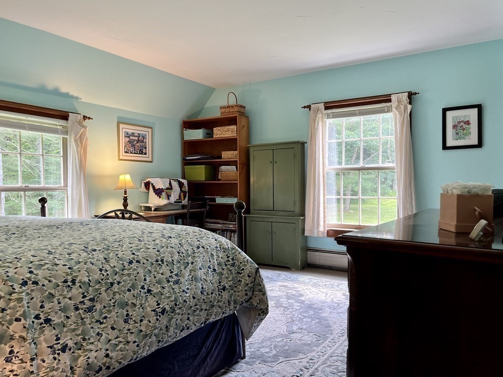 62 West Branch Road Ashfield, MA 01330 - Photo 38 of 42 a bedroom with a bed and a dresser next to a window