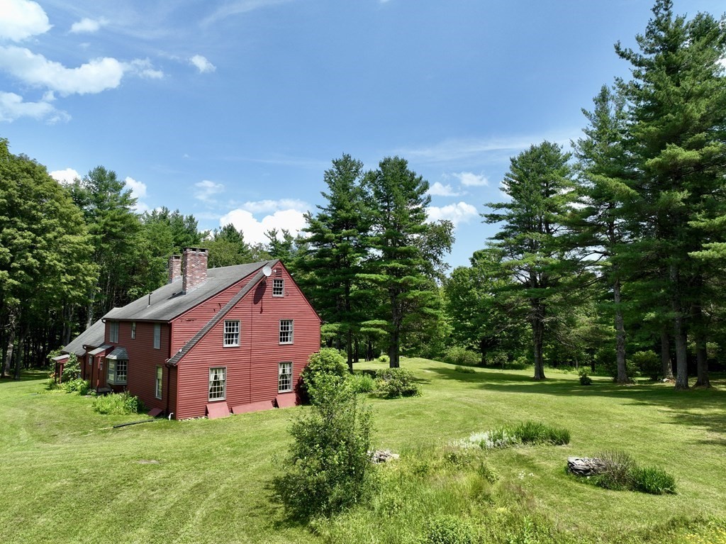 62 West Branch Road Ashfield, MA 01330 - Photo 5 of 42 a front view of a house with garden