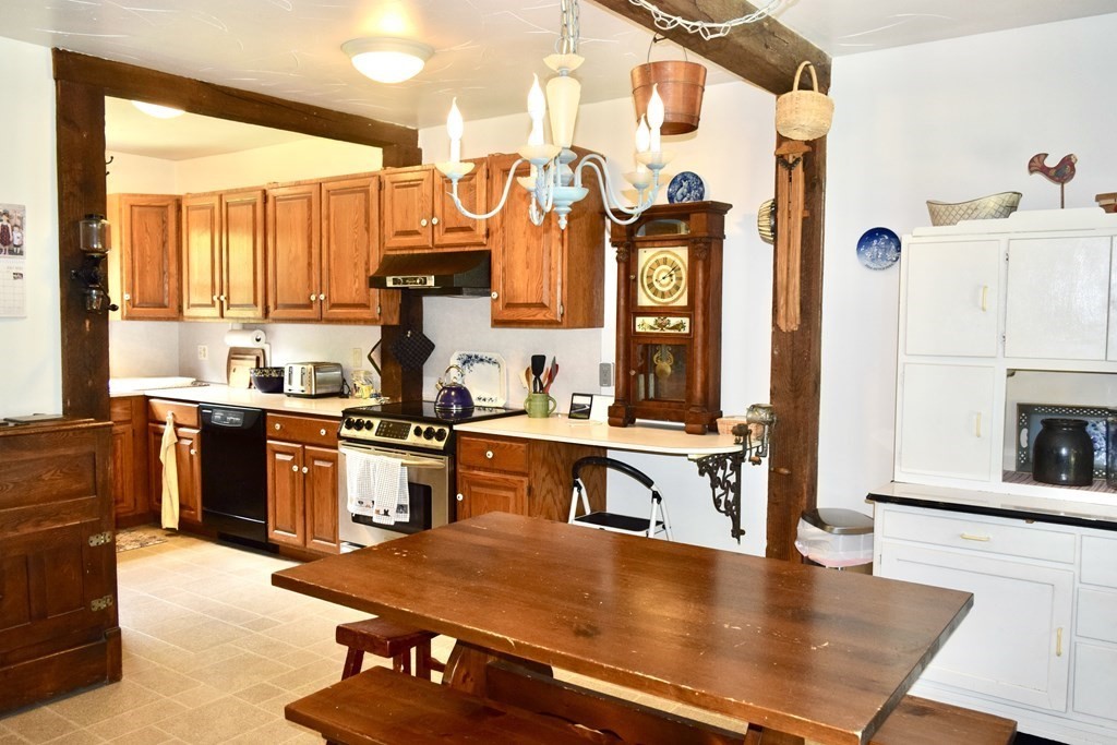 62 West Branch Road Ashfield, MA 01330 - Photo 9 of 42 a kitchen with stainless steel appliances granite countertop a stove and a refrigerator