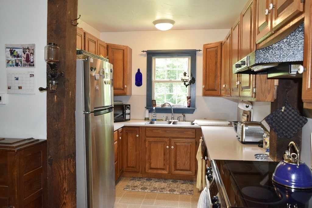 62 West Branch Road Ashfield, MA 01330 - Photo 10 of 42 a kitchen with refrigerator and window