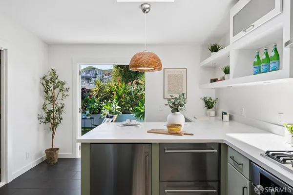 a kitchen with a refrigerator and a sink