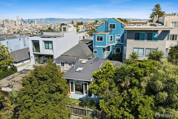 a aerial view of a house with a yard