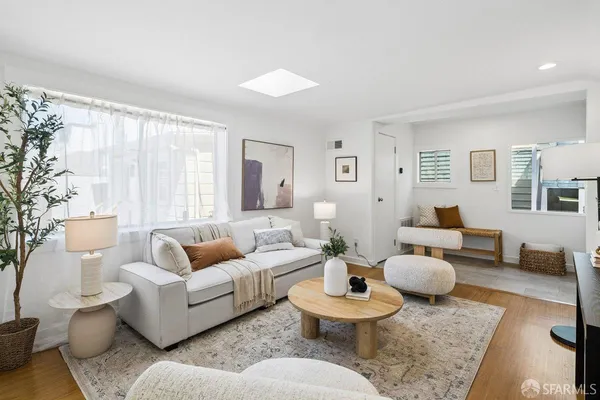 a living room with furniture and a rug