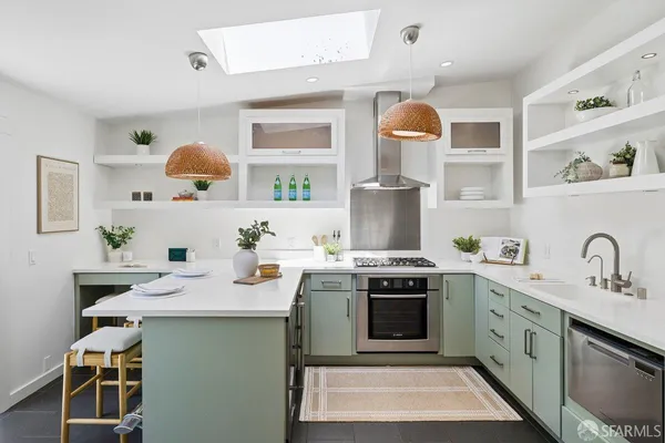 a kitchen with a sink stove and cabinets