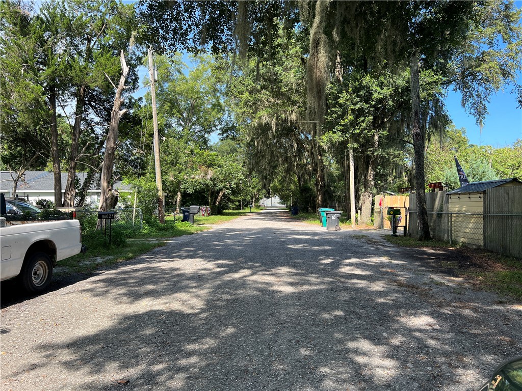 86095 John Street Yulee, FL 32097 - Photo 3 of 4 a view of road with large trees