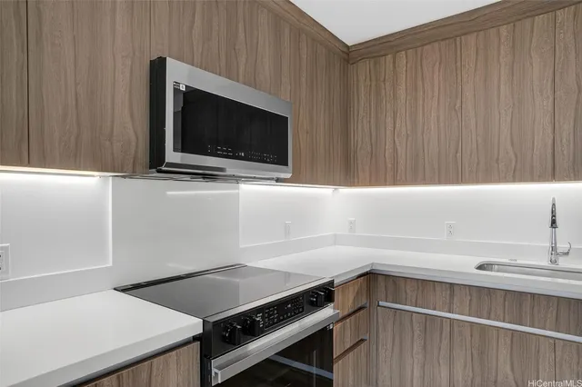 a kitchen with a stove and a microwave