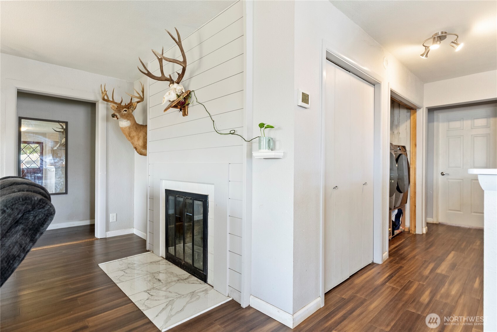 519 Locust Street Omak, WA 98841 - Photo 13 of 33 a view interior of a house with wooden floor and a ceiling fan