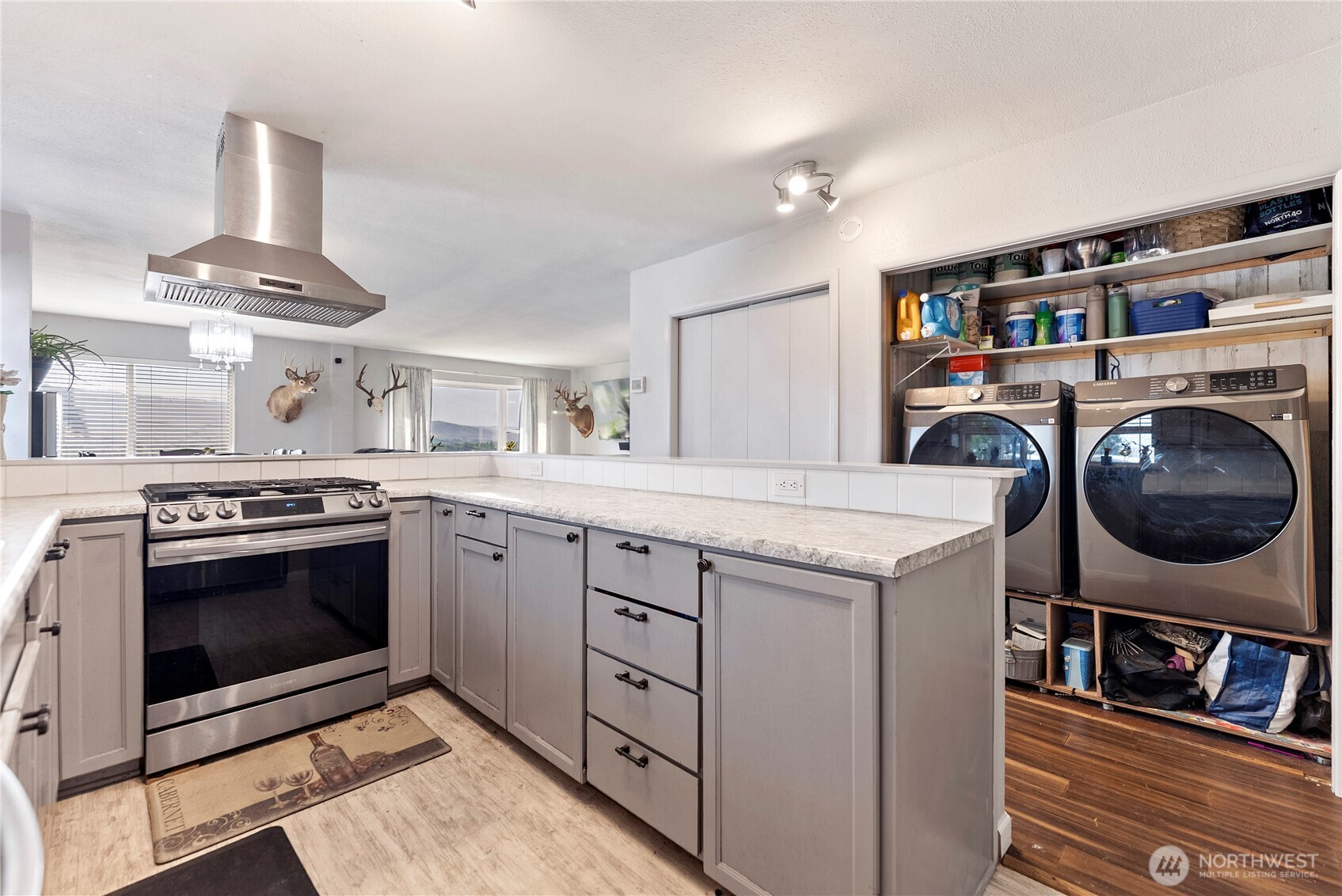 519 Locust Street Omak, WA 98841 - Photo 19 of 33 a kitchen with stainless steel appliances granite countertop a stove and a sink
