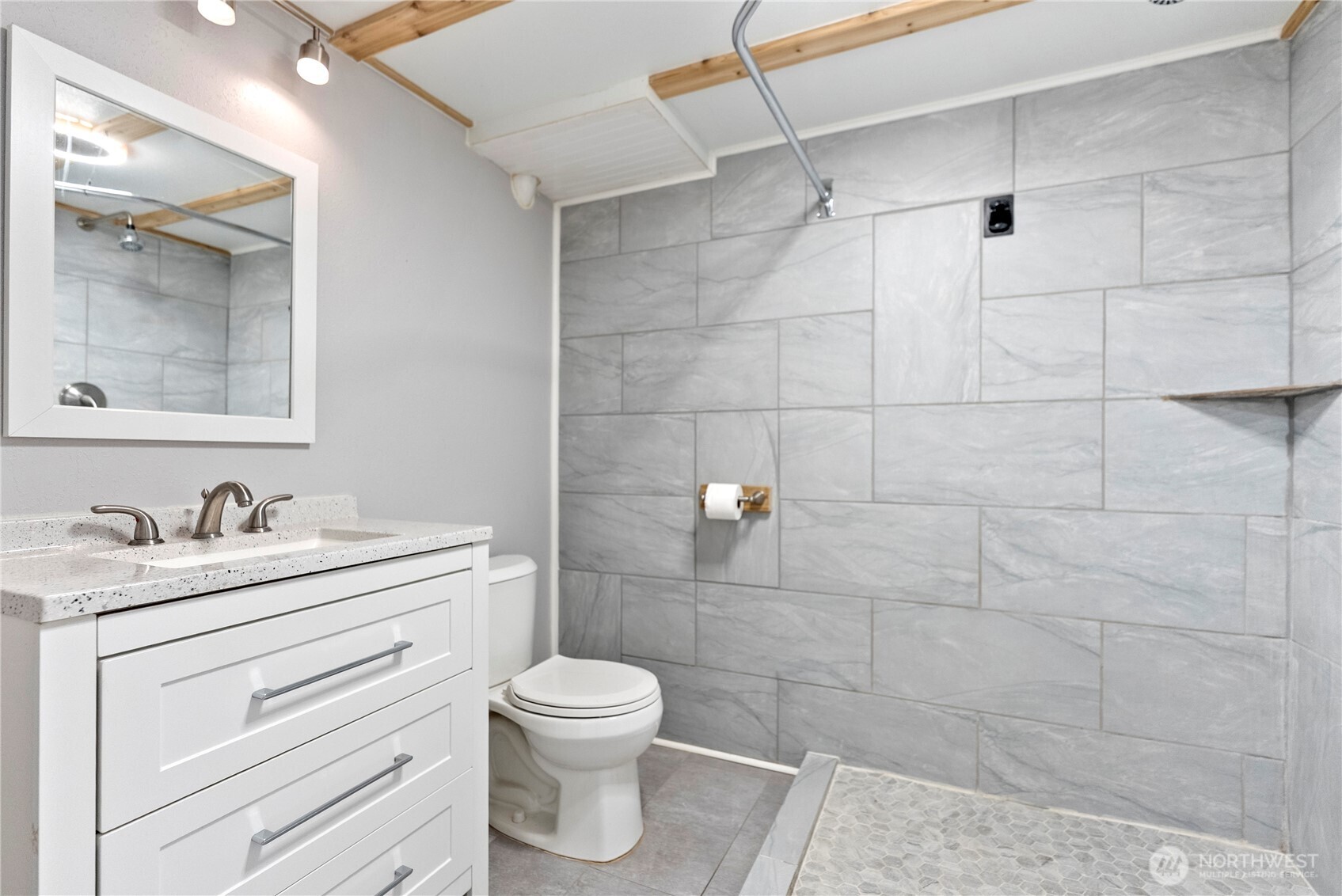 519 Locust Street Omak, WA 98841 - Photo 27 of 33 a bathroom with a toilet sink vanity and mirror